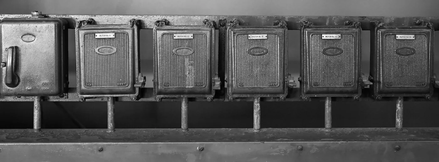 Rows of electrical meters mounted on a wall in Kuching, Sarawak.
