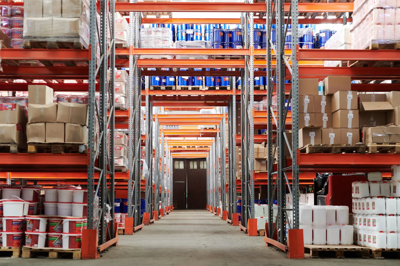 Warehouse aisles lined with storage racks and boxed inventory.